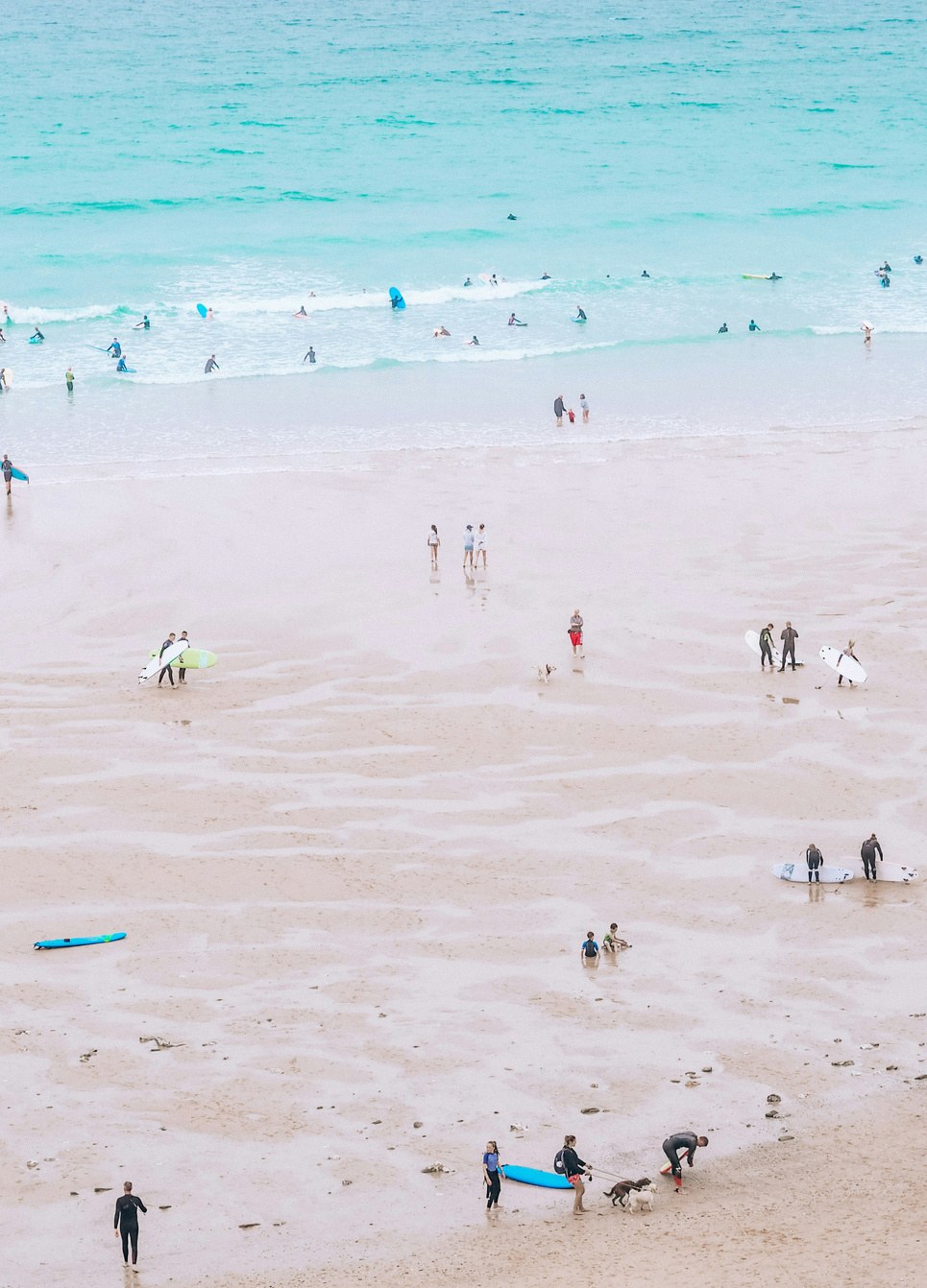 Surfers at Fistral Beach seen from the air