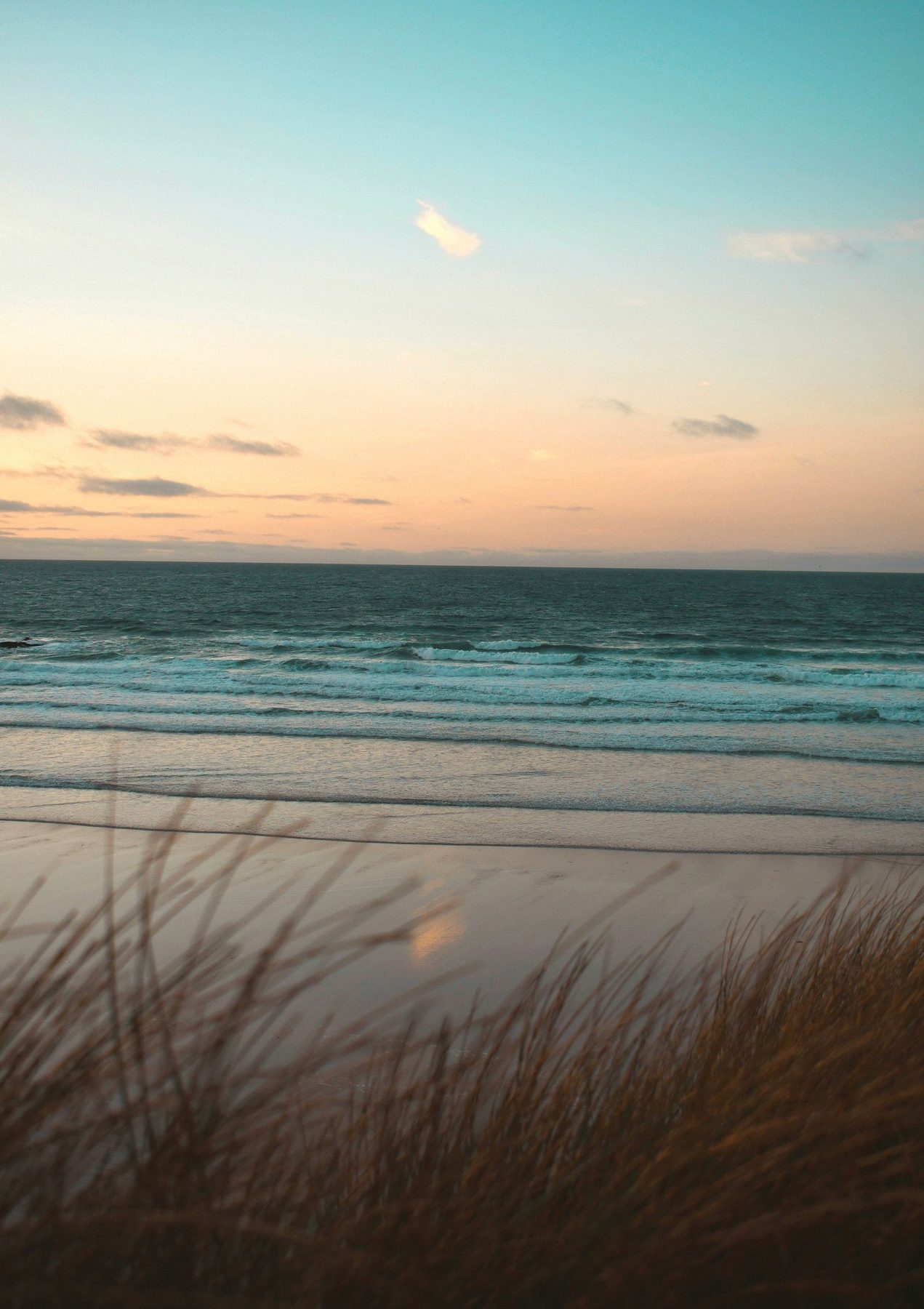 Sunset over the dunes at Fistral Beach