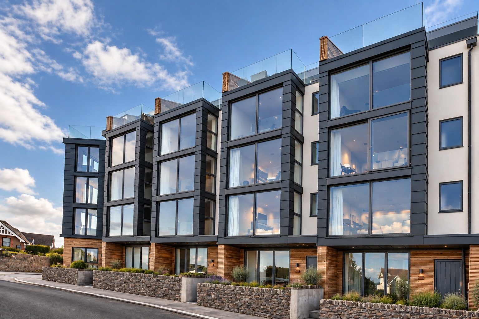 Island Reach — glazed townhouses above Towan Beach