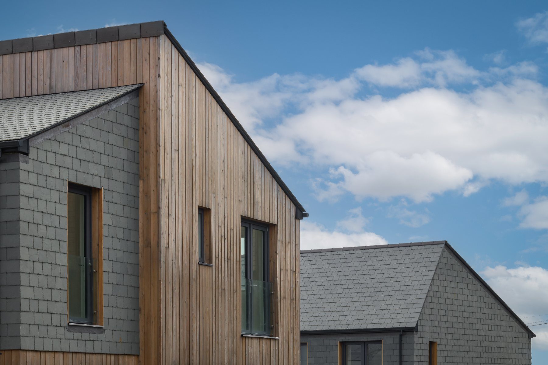 Larch and slate gables at Tessello Rise